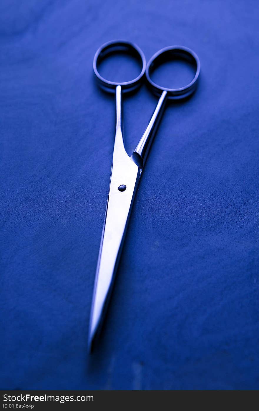 Hair scissors on a piece of sandstone.