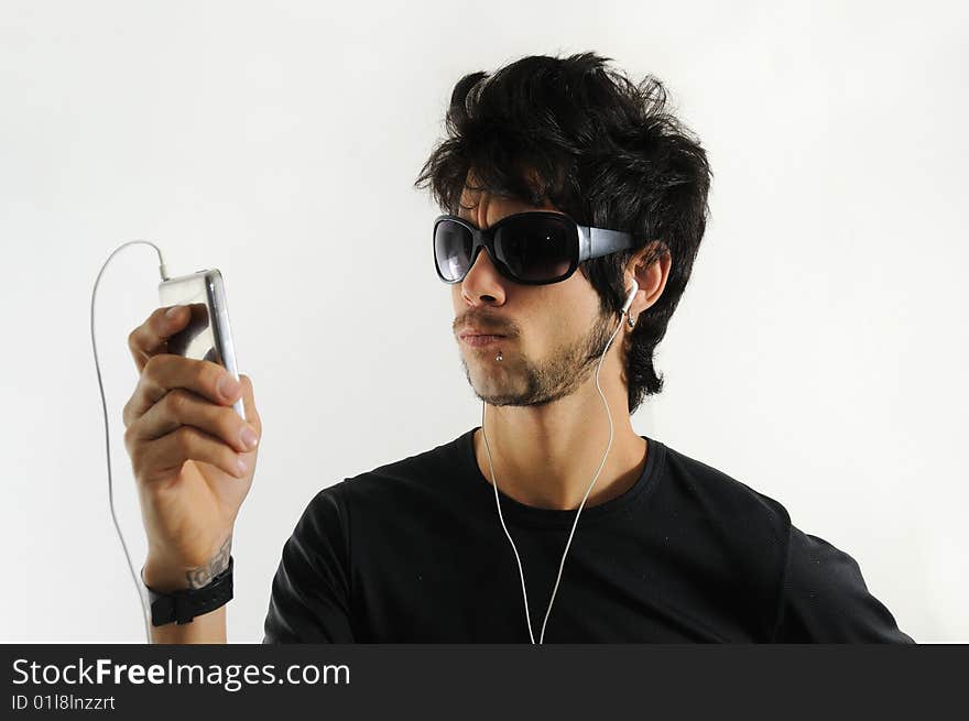 Cool handsome hispanic man listening to music with headphones - isolated. Cool handsome hispanic man listening to music with headphones - isolated