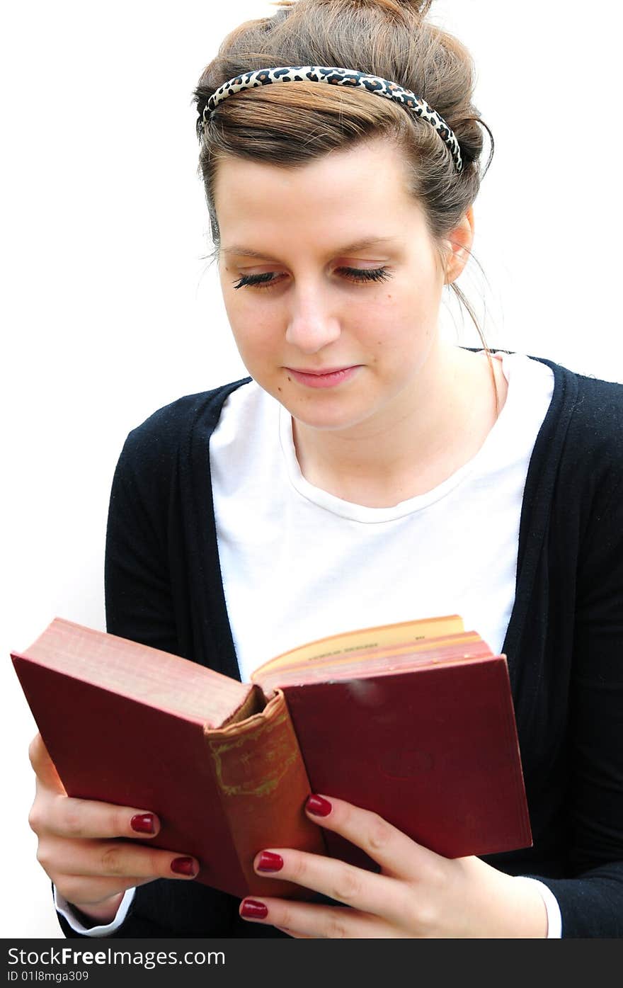 Shot of a girl reading on white