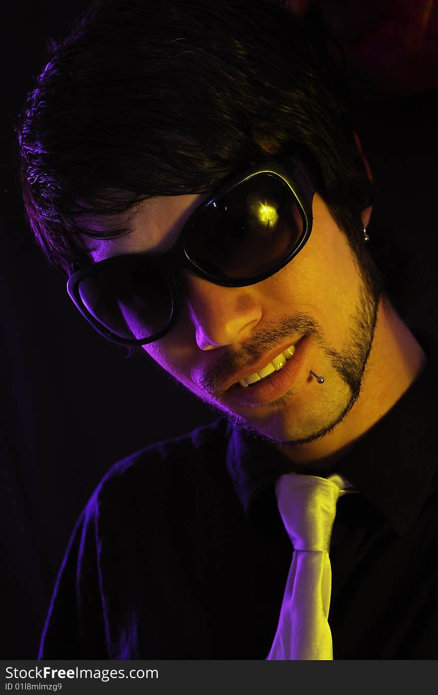 Portrait of young trendy hispanic man wearing sunglasses and tie. Portrait of young trendy hispanic man wearing sunglasses and tie