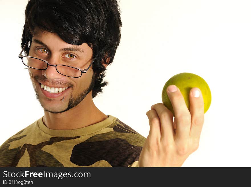 Portrait of healthy young man holding orange fruit and smiling - isolated