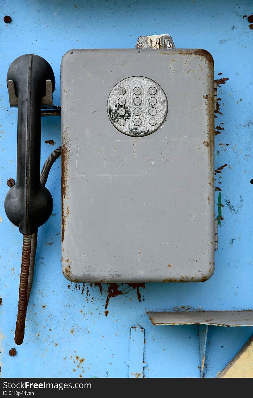 It is a old public phone. It is a old public phone