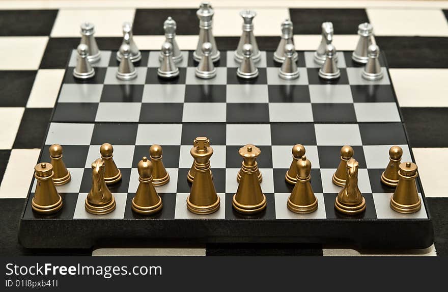 Gold and silver chess on a white background. Gold and silver chess on a white background