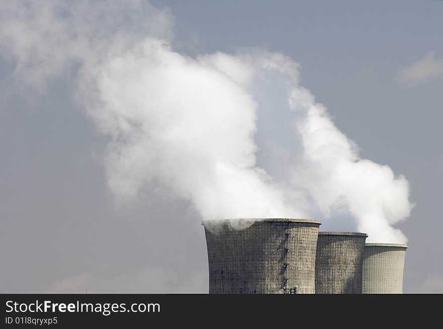 Chimneys of a power plant pollutant. Chimneys of a power plant pollutant