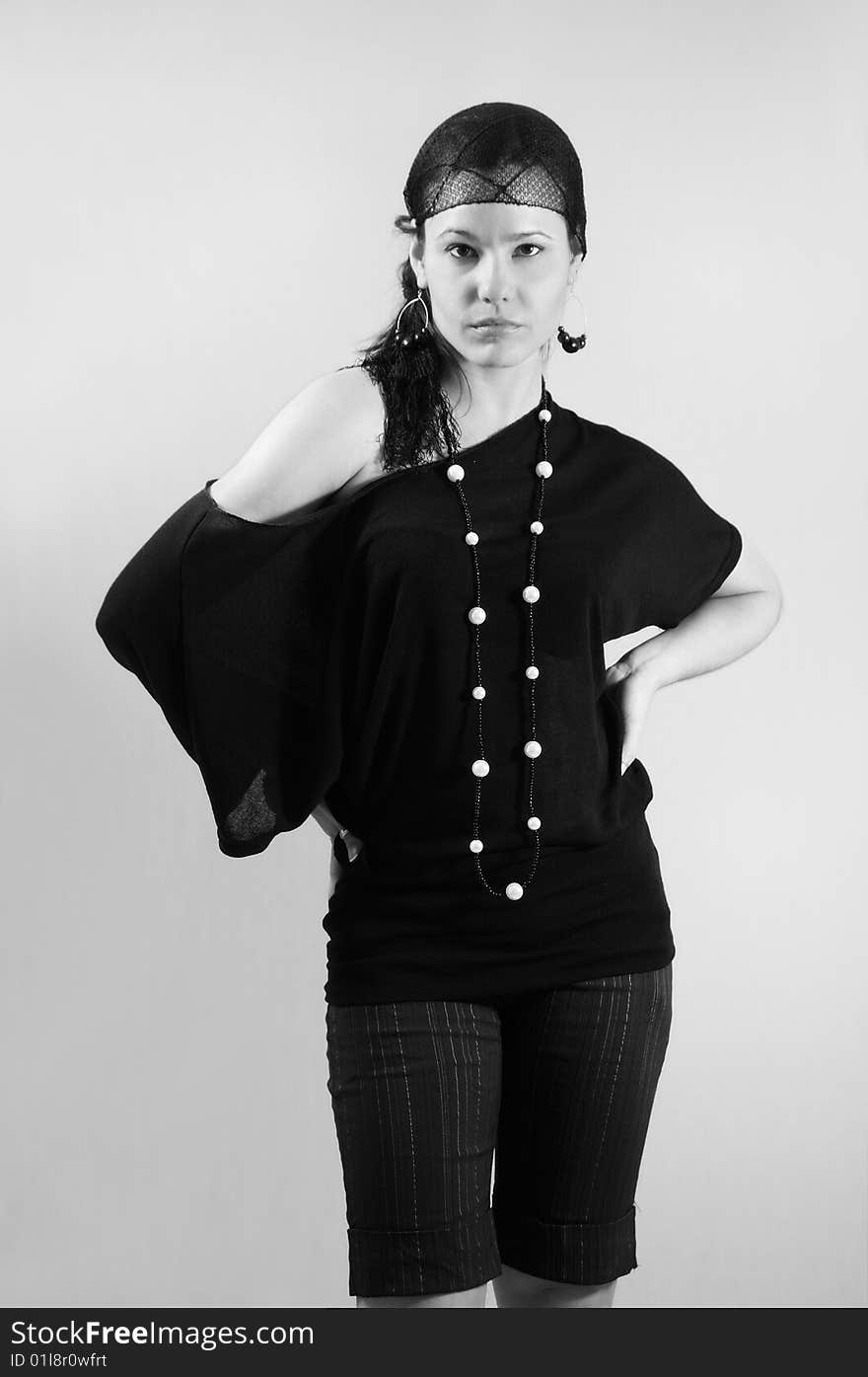 Black and white portrait of young trendy fashion woman posing. Black and white portrait of young trendy fashion woman posing