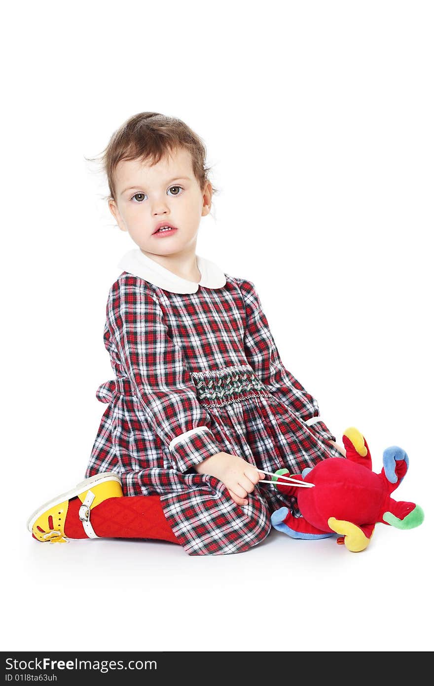 Little girl in checkered dress on white background