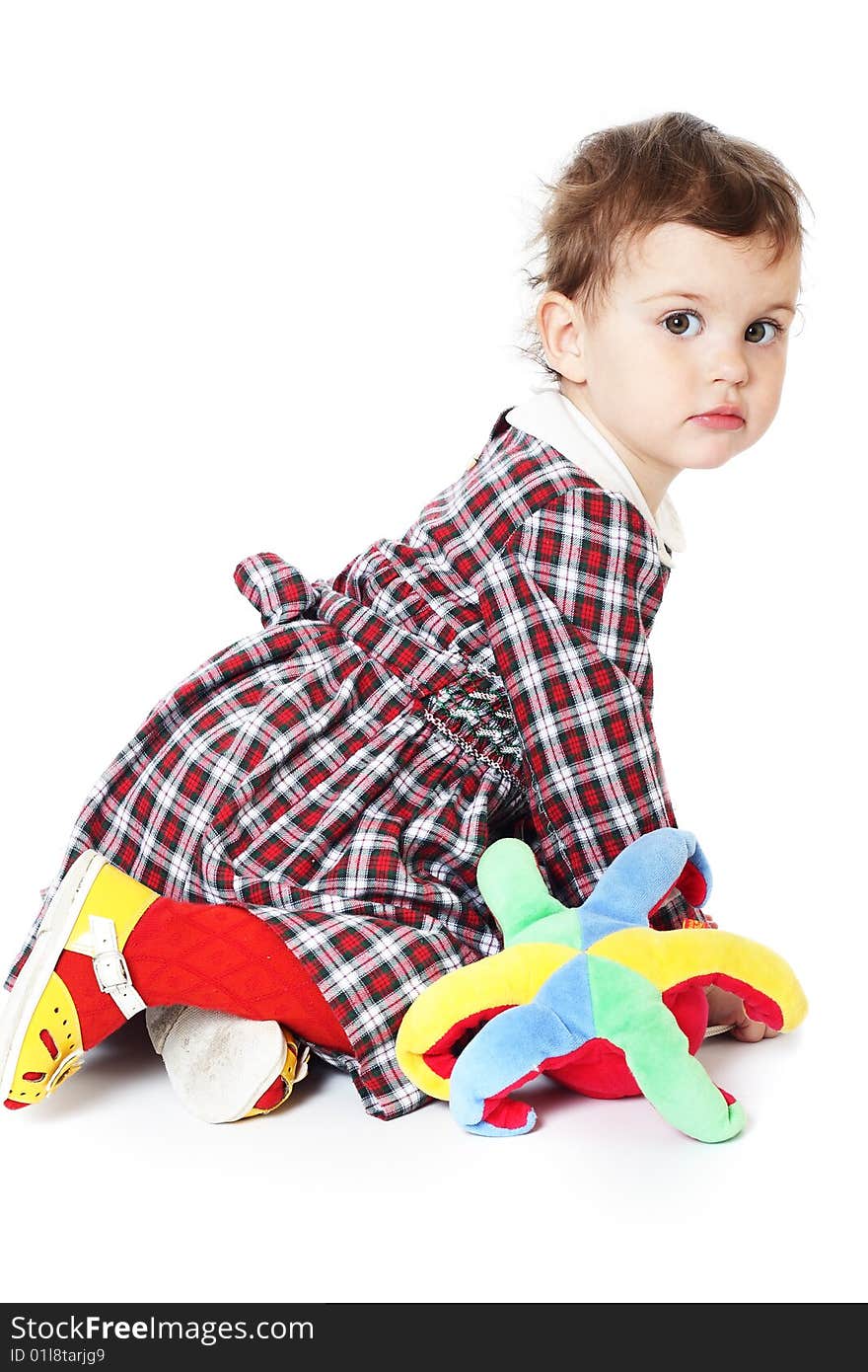 Little girl in checkered dress on white background