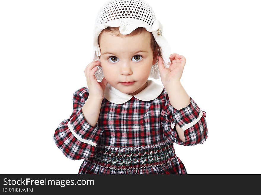 Little girl in checkered dress on white background