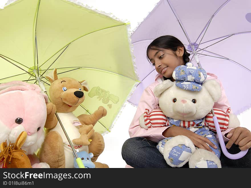 Beautiful girl giving protection to toy family. Beautiful girl giving protection to toy family