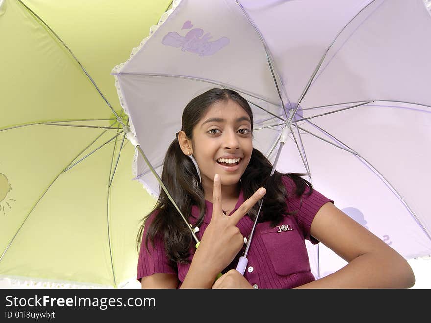 Girl posing with two umbrella