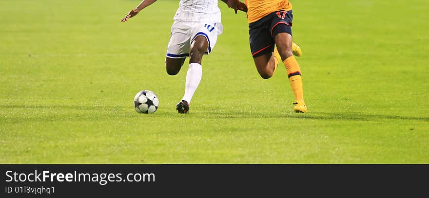 Details of soccer match with two players in action