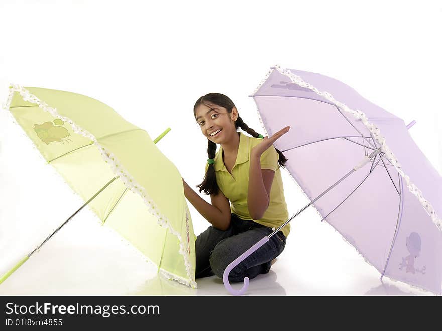 Girl sitting with two umbrella