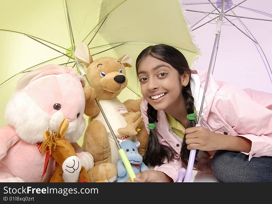 Beautiful girl giving protection to toy family. Beautiful girl giving protection to toy family