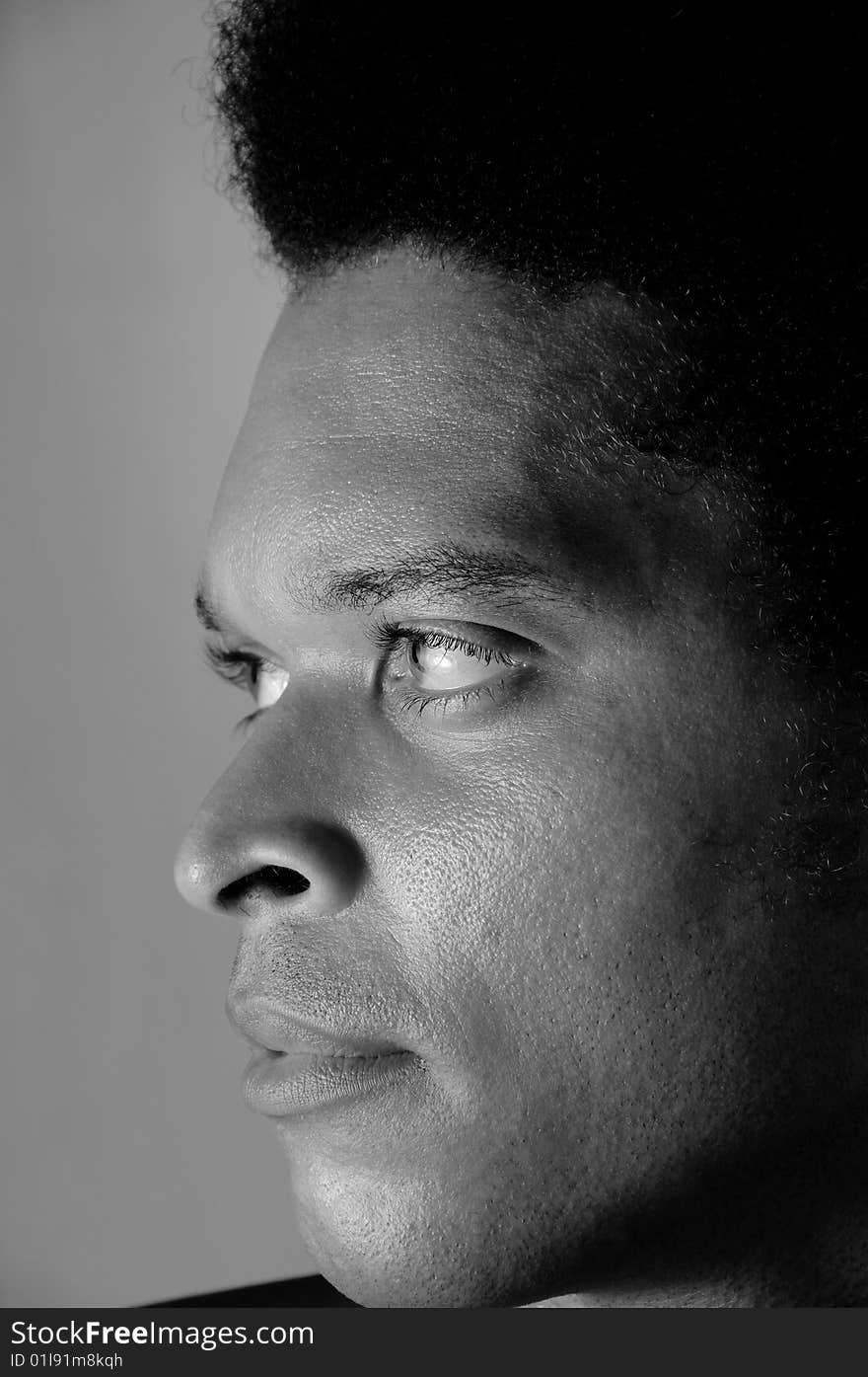 Profile portrait of young african american man in black and white. Profile portrait of young african american man in black and white