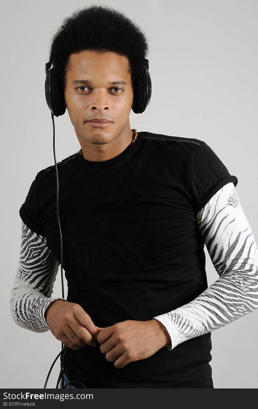 Portrait of young handsome african male model with headphones