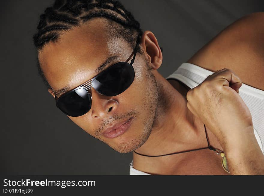 Portrait of young trendy african man with sunglasses. Portrait of young trendy african man with sunglasses