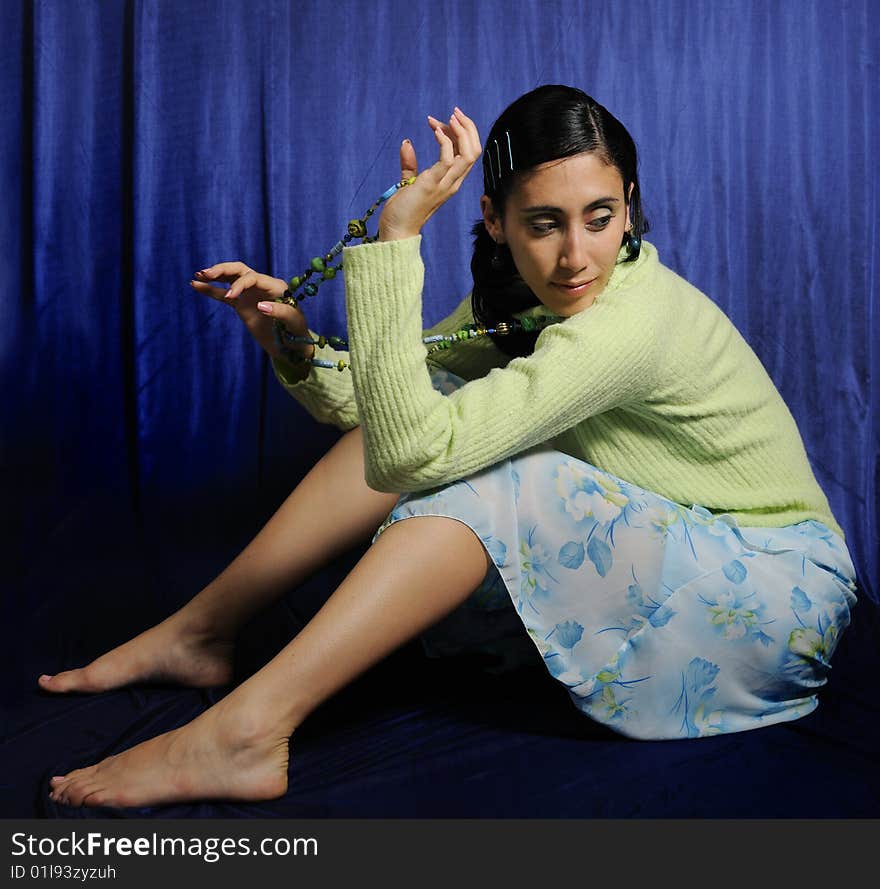 Portrait of young casual hispanic woman sitting. Portrait of young casual hispanic woman sitting