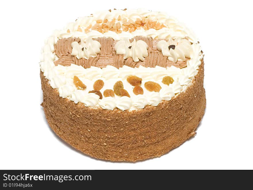 Cake is with cream, raisin and peanut. Cake is with cream, raisin and peanut