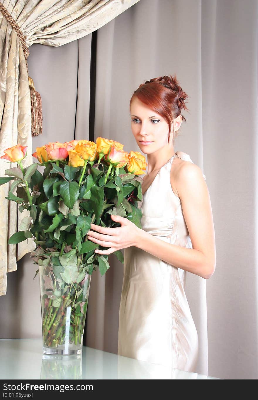 Beautiful young woman with bunch of roses. Beautiful young woman with bunch of roses