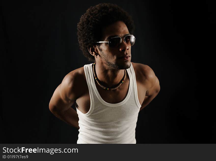 Portrait of young trendy latino man wearing sunglasses. Portrait of young trendy latino man wearing sunglasses