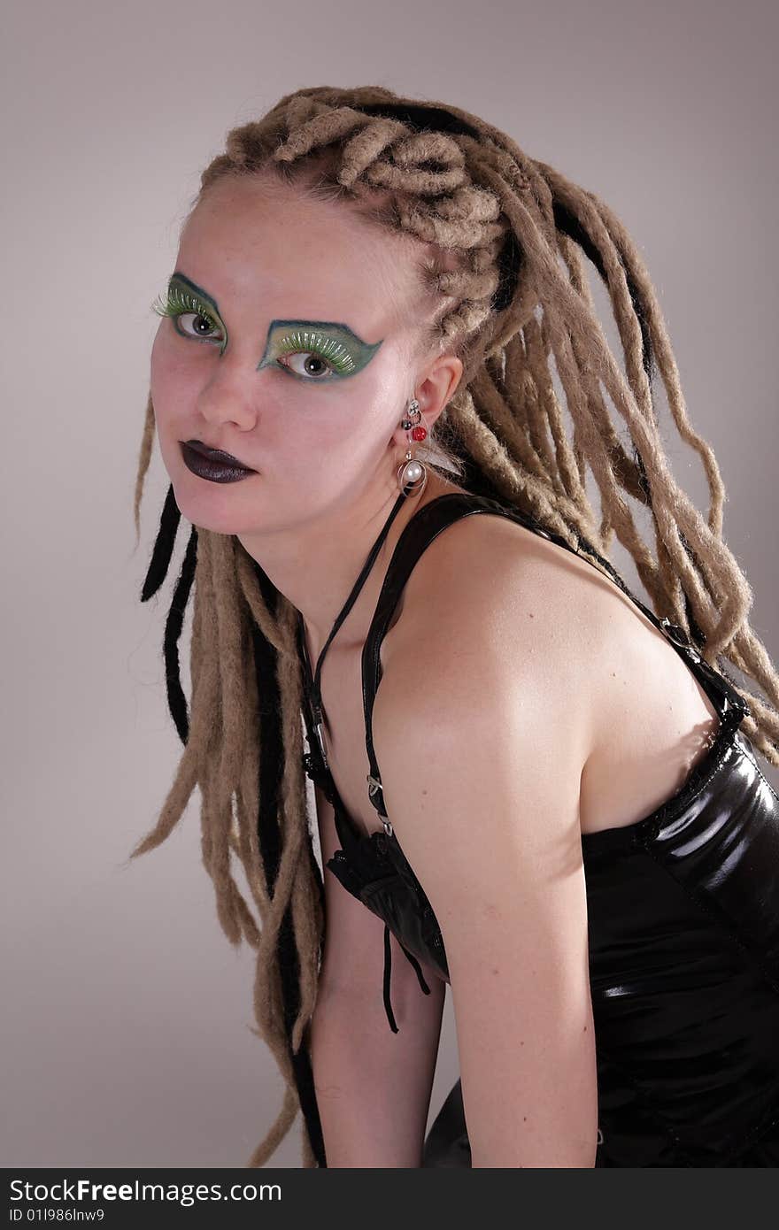 Young woman with dread locks and punk clothing. Young woman with dread locks and punk clothing