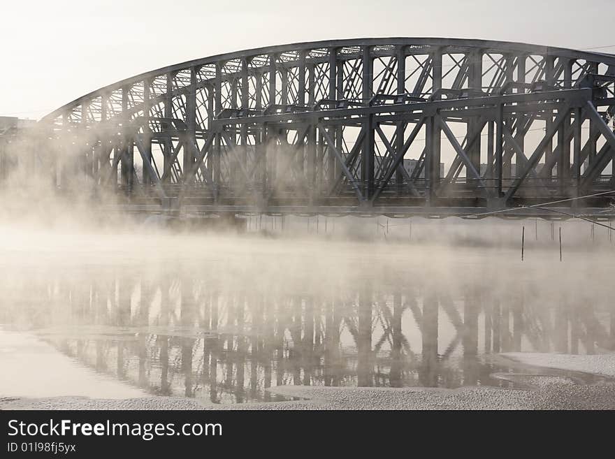 Very cold day, view over a river and bridge