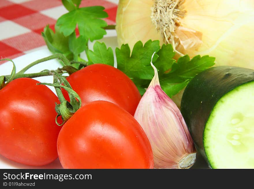 Cucumber, tomato, lettuce and parsley ready to eat. Cucumber, tomato, lettuce and parsley ready to eat.