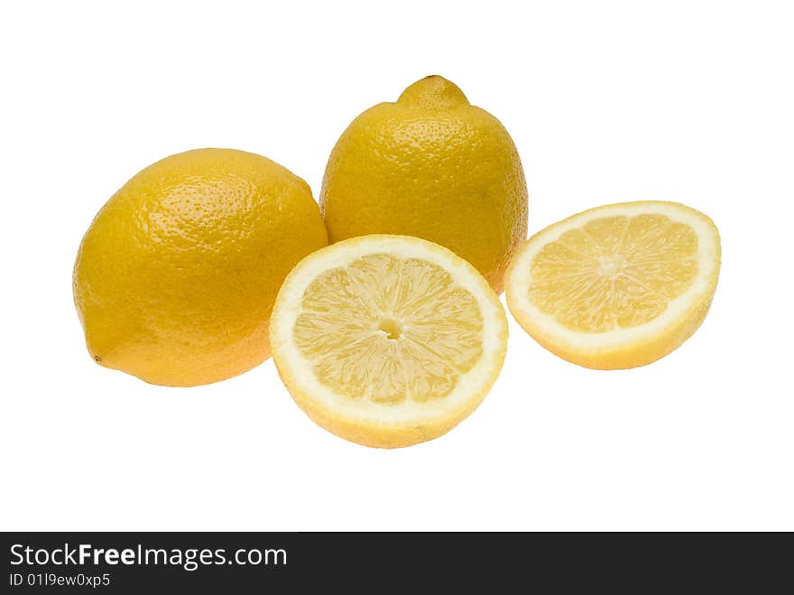 Three lemons one of which is divided in half