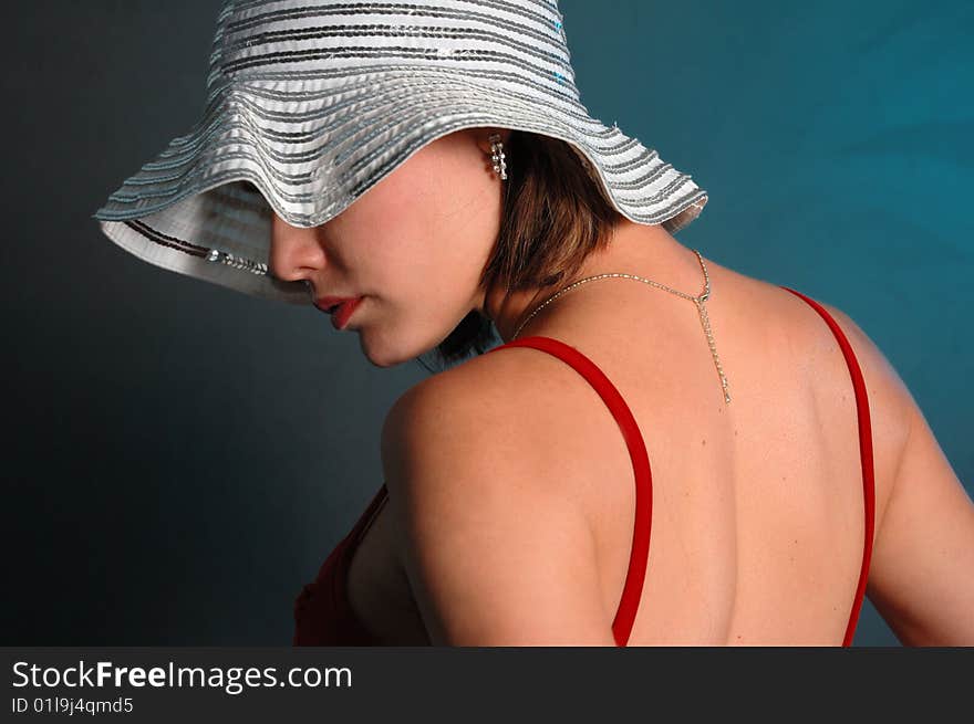 Portrait of young beauty posing with feminine hat. Portrait of young beauty posing with feminine hat