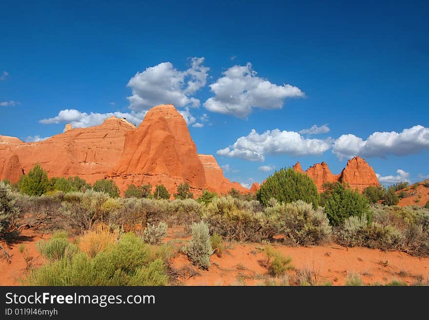 View of the red rock formations in Kodachrome Basin with blue skys and clouds