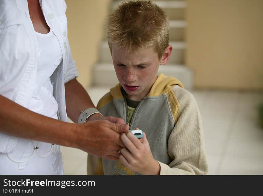 Woman And Boy With A Mobile Phone