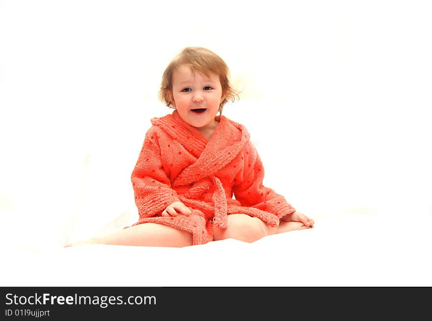 Portrait of the little girl in a dressing gown