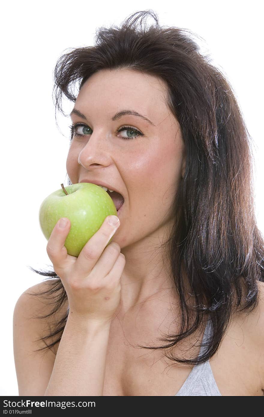 Woman eating a granny smith apple