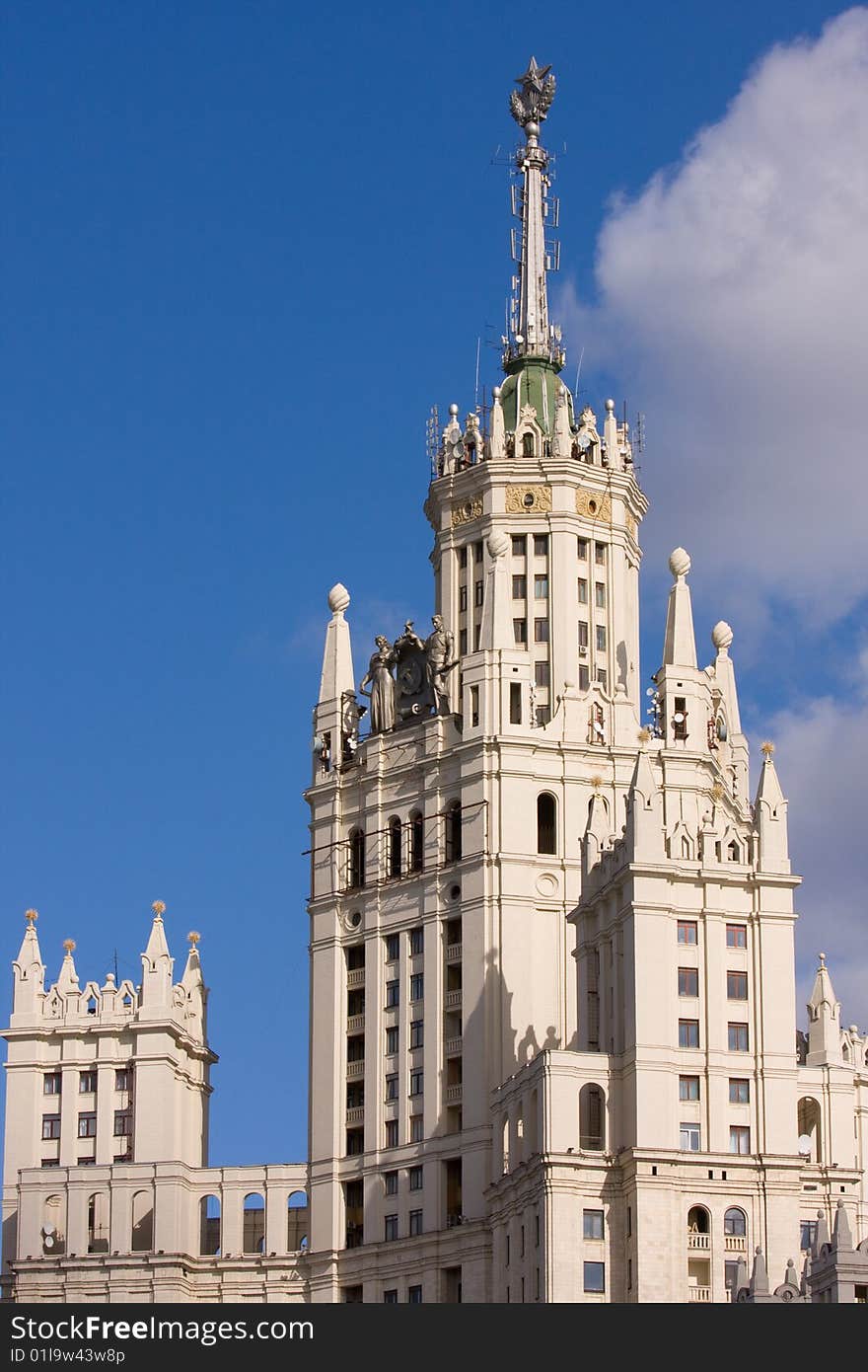 Upper part of skyscraper in Moscow - Kotelnicheskaya Embankment Building is one of seven Stalinist skyscrapers laid down in September, 1947 and completed in 1952, designed by Dmitry Chechylin (then Chief Architect of Moscow) and Andrei Rostkovsky. Main tower has 32 levels (including mechanical floors) and is 176 meters tall. Located on Moscow river in central Tagansky district of Moscow, Russia. Upper part of skyscraper in Moscow - Kotelnicheskaya Embankment Building is one of seven Stalinist skyscrapers laid down in September, 1947 and completed in 1952, designed by Dmitry Chechylin (then Chief Architect of Moscow) and Andrei Rostkovsky. Main tower has 32 levels (including mechanical floors) and is 176 meters tall. Located on Moscow river in central Tagansky district of Moscow, Russia