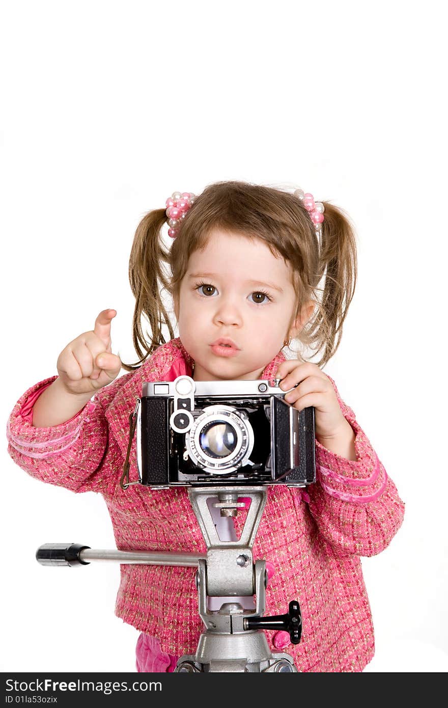 Attractive little girl with photo camera over white. Attractive little girl with photo camera over white