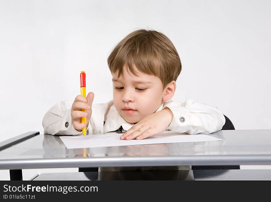 Adorable little boy with pencil