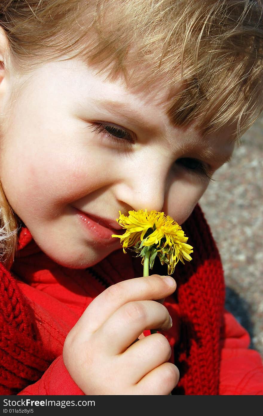 Girl smelling a flower