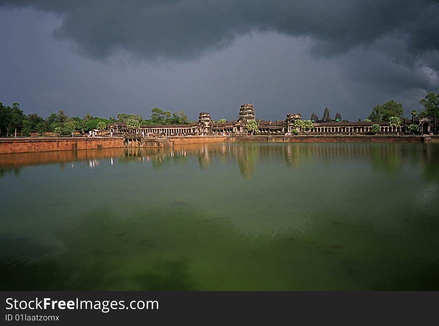 The Angkor wat and its pool after a storm. The Angkor wat and its pool after a storm