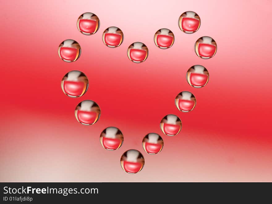 Water drops in the form of heart on a celebratory background