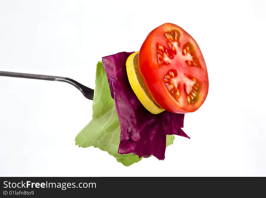 Collection of cutting tomato lemon beetroot and cabbage in fork. Collection of cutting tomato lemon beetroot and cabbage in fork