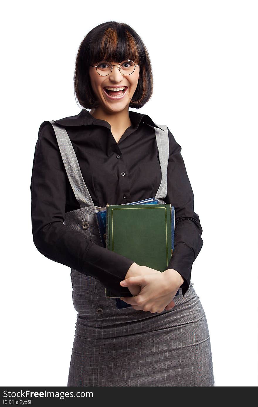 Laughing brunette schoolgirl hold books in the hands over white background