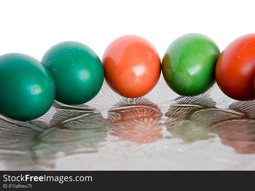 Five colored eggs on a transpearent dish. Five colored eggs on a transpearent dish