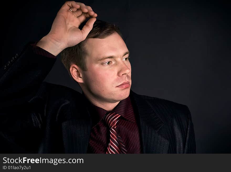 Young Man On A Black Background