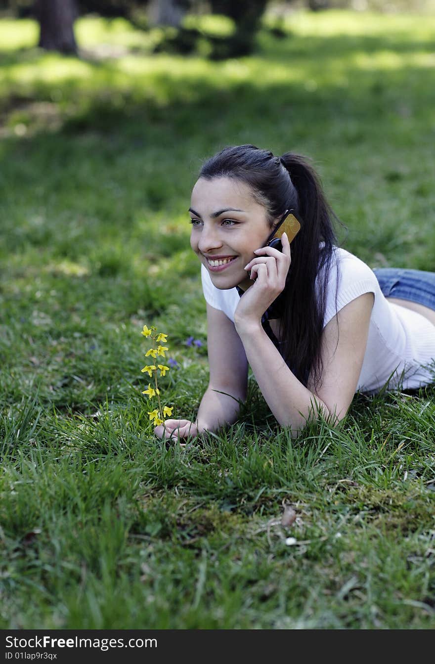 Smiling girl talking over the phone