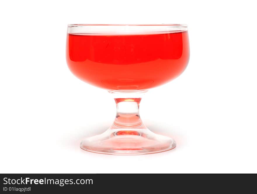 Red jelly in transparent glass, transparent, on white background. Red jelly in transparent glass, transparent, on white background