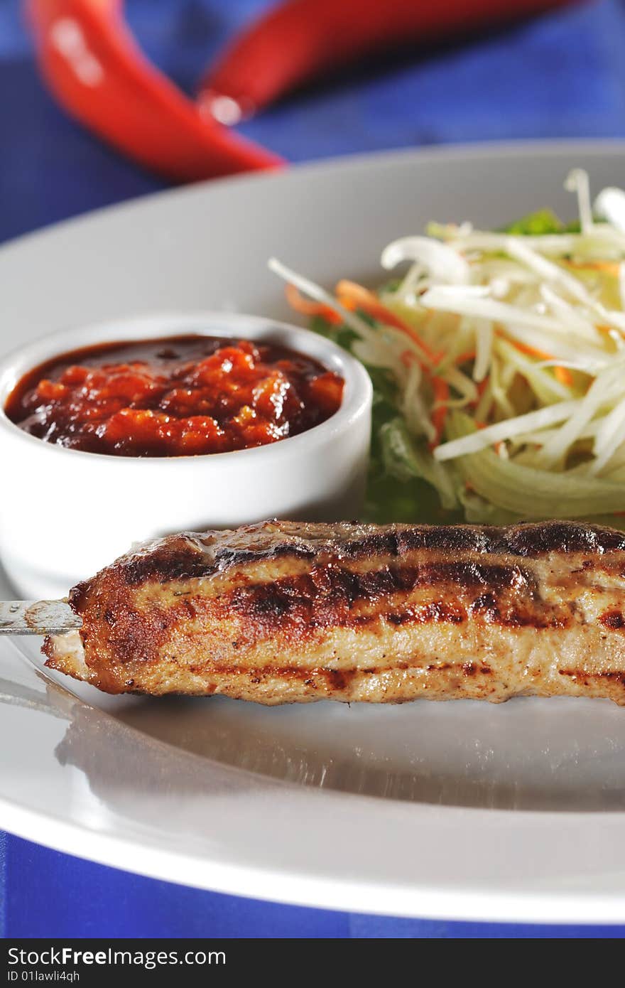 Hot Meat Dishes - Grilled Meat with Red Chile Sauce and Salad