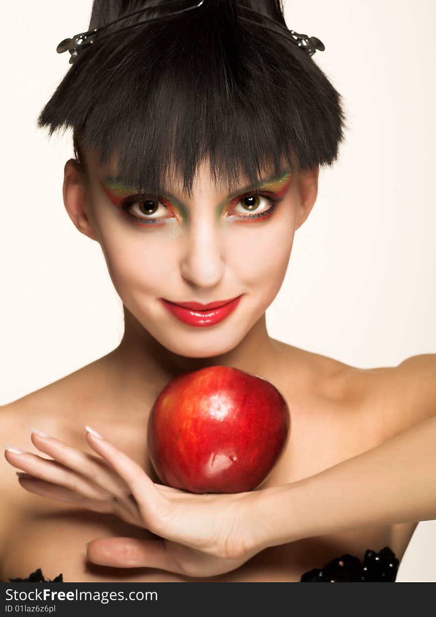 Portrait of pretty brunette with red apple. Portrait of pretty brunette with red apple