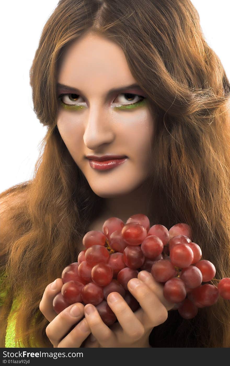 Portrait of young girl witn  dark grapes