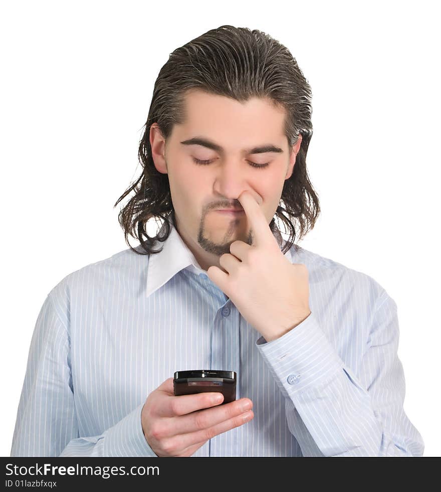 Young funny dark haired guy in light blue shirt dials on his mobile phone and picks his nose isolated on white. Young funny dark haired guy in light blue shirt dials on his mobile phone and picks his nose isolated on white