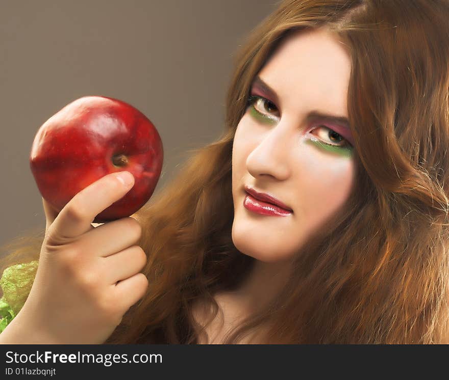 Portrait of young girl witn red apple in her hand. Portrait of young girl witn red apple in her hand